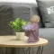 Mönchsfigur mit Lotusblüte als Teelichthalter, 13 cm